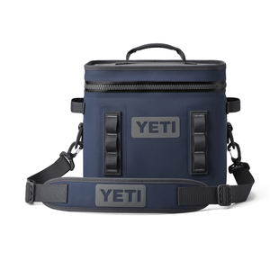 Blue YETI cooler bag with black straps on a white background