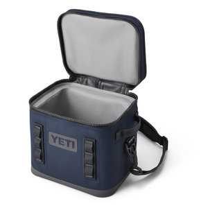 Blue YETI cooler bag with open lid on a white background