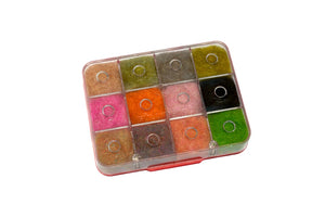 fly tying material in box on white background