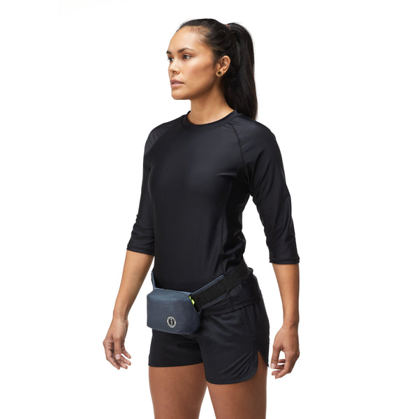 woman in black shorts and thsirt wearing fannypack