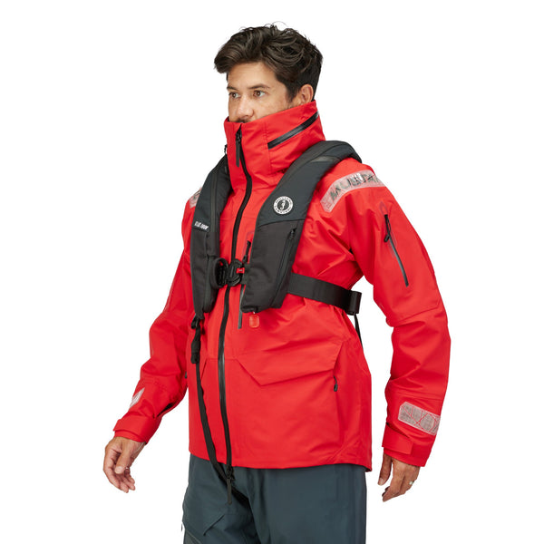 man wearing lifesaving vest over red jacket