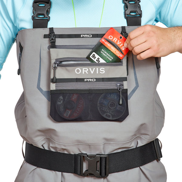 Man wearing Men's Pro Waders in grey, top pocket detail