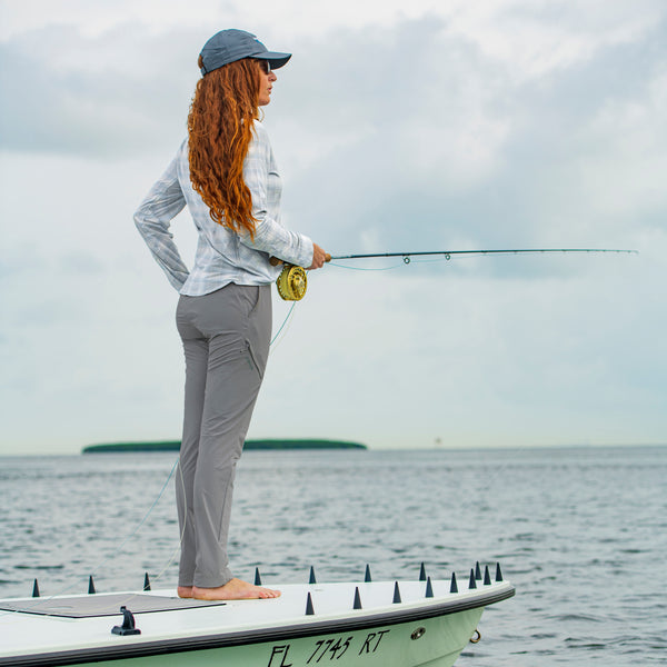 Woman fishing on a kayak in Miami